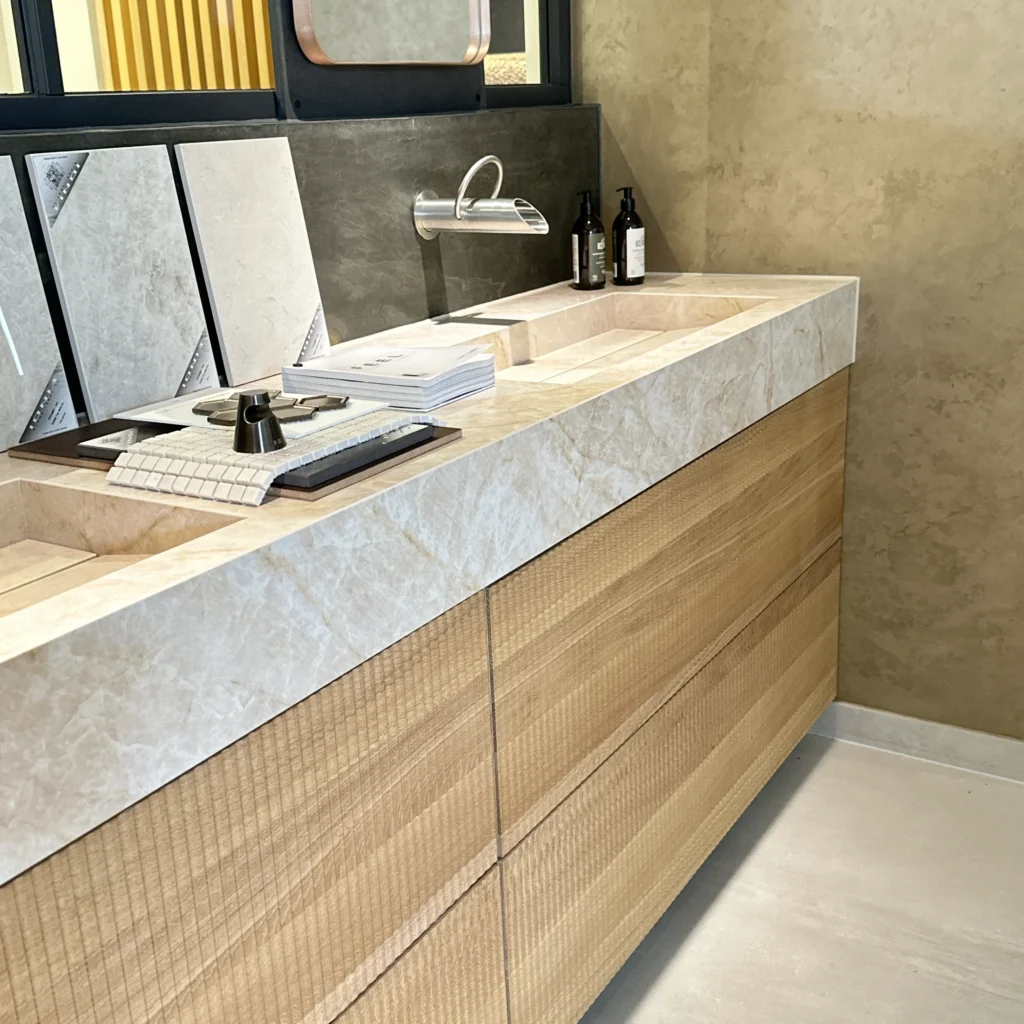 Bespoke bathroom vanity with oak wood fronts and ceramic countertop, showcasing expertise in luxury bathroom designs.